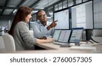 Two Professionals Analyzing Financial Reports And Tracking Data On Computer Screens
