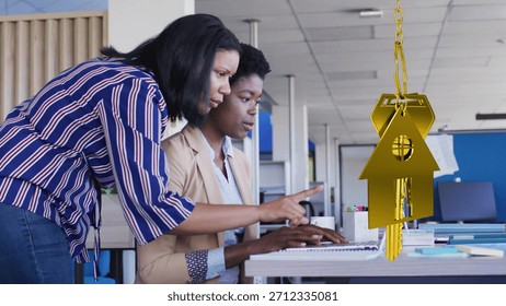 Two professionals are collaborating at desk in flat design business office, featuring gold keychain. Collaboration, teamwork, productivity, modern, corporate, business, innovation