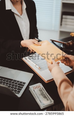 Two professionals exchanging an envelope of cash over contract documents on an office desk, symbolizing bribery, clandestine illegal payment and unethical corporate transaction