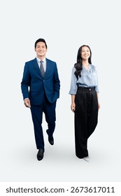 Two professionals walking towards the camera. Both of them are looking at the camera and smiling on white  background 		