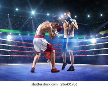 Two professionl boxers are fighting on the grand arena - Powered by Shutterstock