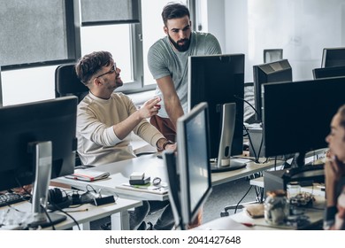 Two programmers at the office.They discuss and working on new project.	
 - Shutterstock ID 2041427648