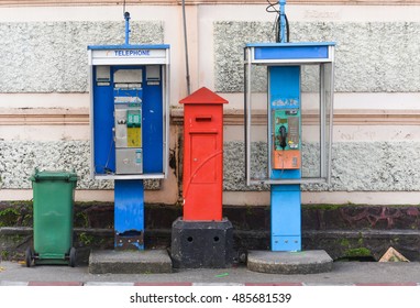 Two Public Phone Booth With Mail Box And Green Bin