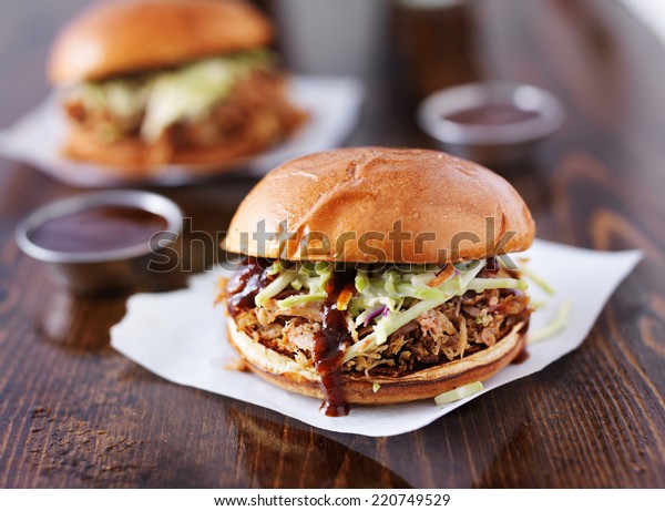 two pulled pork barbecue\
sandwiches