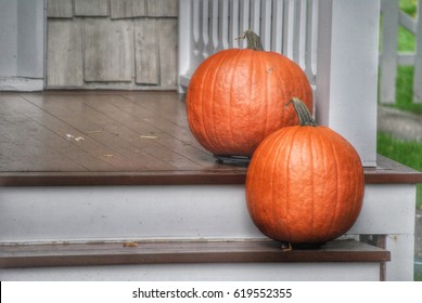 Two Pumpkins On Wooden Porch Steps 