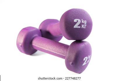 Two Purple Dumbells On White Background With