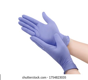 Two purple surgical medical gloves isolated on white background with hands. Rubber glove manufacturing, human hand is wearing a latex glove. Doctor or nurse putting on nitrile protective gloves