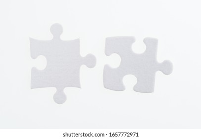 Two Puzzle Pieces On White Background.
