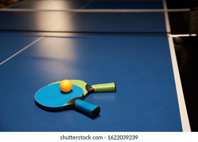 Two rackets and a ball for playing table tennis (ping pong)