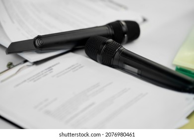 Two Radio Microphones On Sheets Of Paper With A Scenario Plan. High Quality Photo