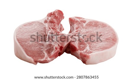 Two raw fresh pork chops with bone in