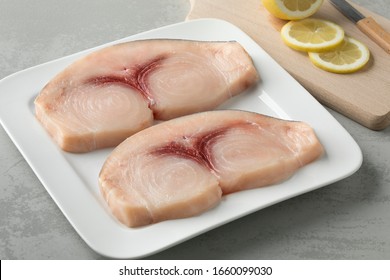 Two Raw Fresh Swordfish Fillets On A Dish