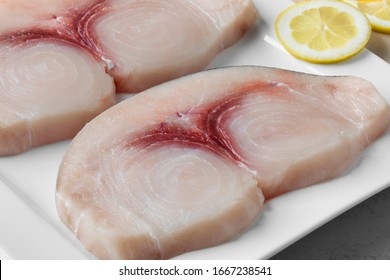 Two Raw Fresh Swordfish Fillets On A Dish Close Up