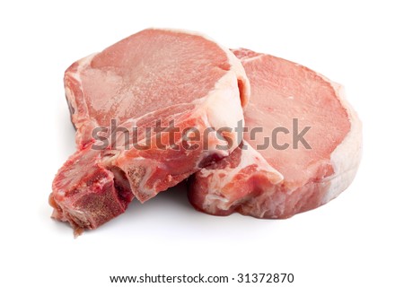 Two raw pork chops on white background