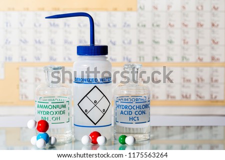 Two reagent bottles containing hydrochloric acid, ammonium hydroxide, water and their molecular models.