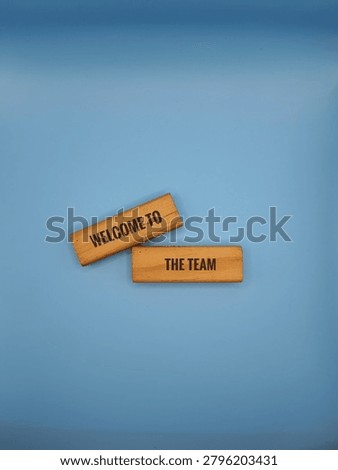 Two rectangular wooden blocks stamped with the words 