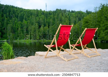 Similar – Image, Stock Photo two red beach chairs on a meadow by the sea