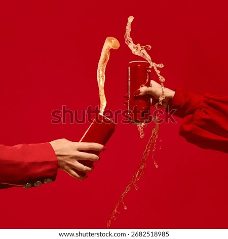 Two red cans collide with beer splash on vibrant red background full of energy. Concept of beverage branding, editorial visuals, monochromatic campaigns, and youth marketing. Mockup for text, ad