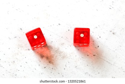 Two Red Craps Dices Showing Snake Eyes (double Number One) Overhead Shot On White Board