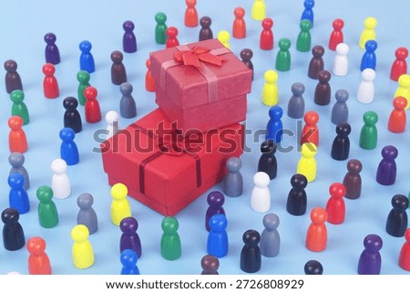 Two red gift boxes and many people figures on blue background. Birthday and resent concept. 