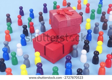Two red gift boxes and many people figures on blue background. Birthday and resent concept.