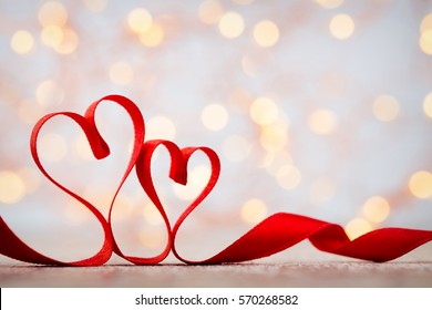 Two red hearts of ribbon. Valentines day greeting card. - Shutterstock ID 570268582