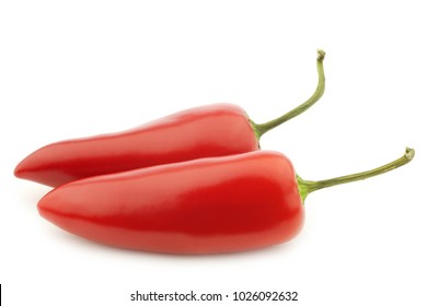 two red jalapeno peppers on a white background