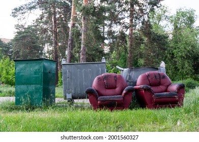 Two red leather chairs. Furniture in the trash can. Workplace in the forest. Landfill furniture. Furniture in the woods. Rest in the forest. - Shutterstock ID 2001560327