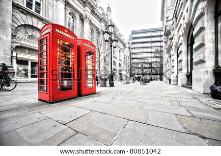 two red phone booths on the street