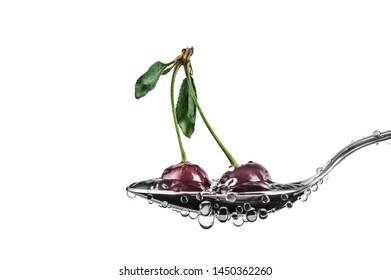 Two Red Sweet Cherry Berries In A Tablespoon With Drops Of Water In A White Background In Horizontal Format