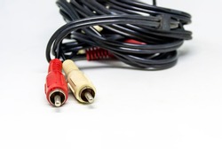 Two Red And White Audio RCA Plugs Isolated On A White Background. Analog Technology. Commonly Used To Carry Audio And Video Signals