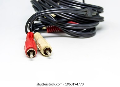 Two Red And White Audio RCA Plugs Isolated On A White Background. Analog Technology. Commonly Used To Carry Audio And Video Signals