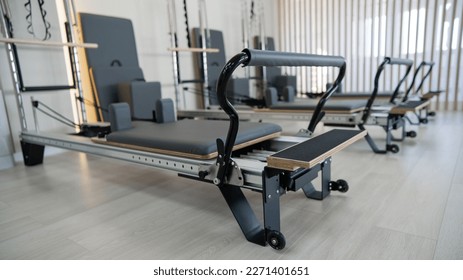Two reformer machines. Pilates studio without people.  - Powered by Shutterstock