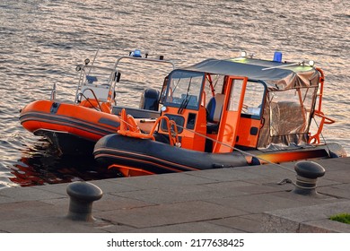 Two Rescue Boats Are On The Pier. Rubber Patrol Boat No People On The Water.