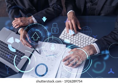 Two research and development specialists man and woman working on project to create a new approach to develop software to improve business. Technological icons over the table with document. - Powered by Shutterstock