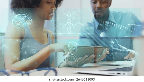 Two researchers collaborating, examining medical holograms on tablet at lab, laptop and eyeglasses. Innovation, collaboration, technology, healthcare, digital, research, futuristic