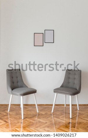 Similar – Alte Stühle und Tafel in einem Raum als Stillleben