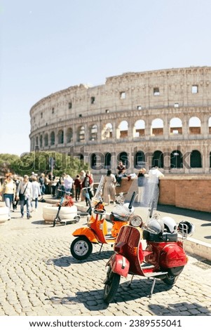 Two Retro scooters stay near the Roman Coliseum. One of the most popular travel place in world, postcard
