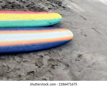 Two Retro Surf Boards Resting On The Sand In Maui