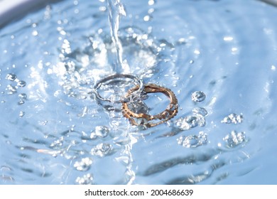 Two ring water. Love concept. Background. Wedding rings. Water.  - Powered by Shutterstock