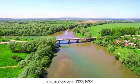 Two Rivers Of Different Colors Of Water Merge Into One Large River