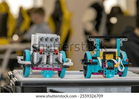 two robots are standing in the background of the competition