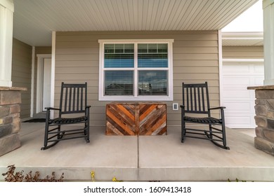 Two Rocking Chairs On A Covered Patio