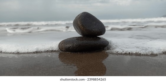 Two Rocks stacked in a eautiful beach