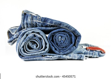 Two rolled blue denim jeans on white background - Powered by Shutterstock