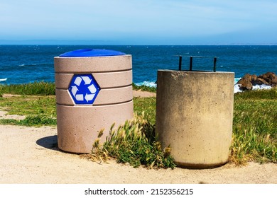 Two Round Cement Trash Cans For Garbage And Recycling. Background Scenic Pacific Ocean Coastline.