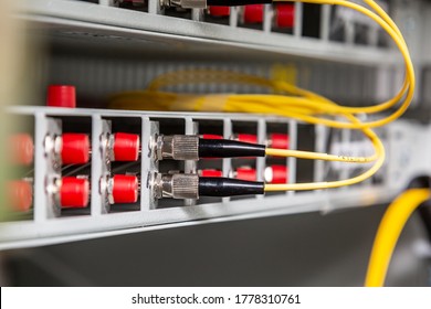 Two Round Fiber Optic Cables Inserted Into The Switch. Horizontal Orientation. 