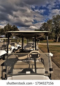 Two Rows Of Empty Parked Golf Carts