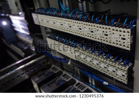 two rows of several contactors in a control cabinet