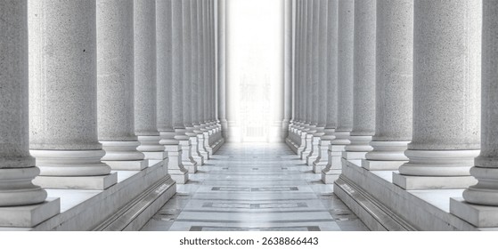 Two rows of white marble columns. Hallway with white pillars. Bright light between two rows of columns